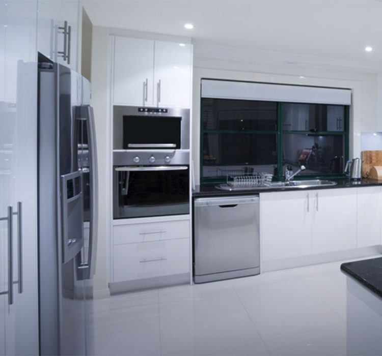 Island shape modular kitchen 3 Modern white kitchen with stainless steel appliances featuring a side-by-side refrigerator, built-in wall oven, microwave, and dishwasher. Black splash window above sink, glossy white cabinetry, and reflective tile flooring create a sleek contemporary space.