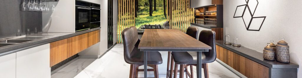 Wide view of a kitchen and dining display at the ALEA experience centre