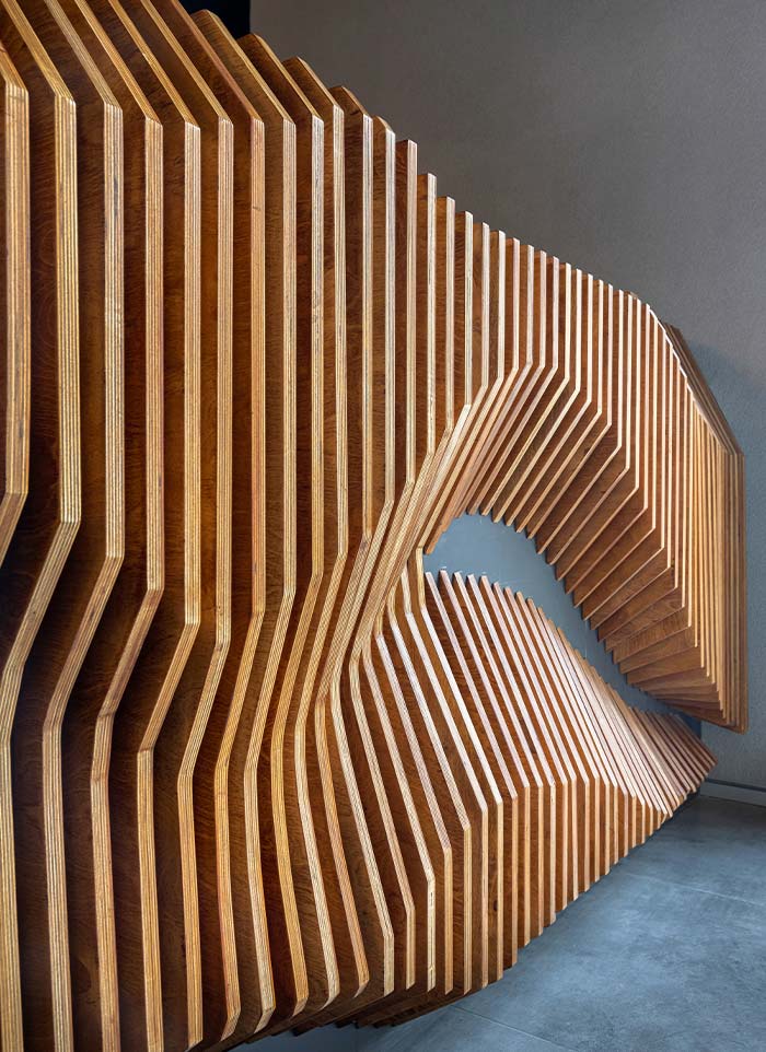 Sculpted timber slat feature wall at the ALEA experience centre