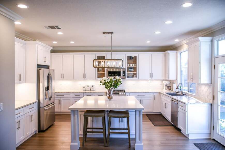 What is the best kitchen layout for you and why? 1 Elegant u-shaped modular kitchen by alea modular kitchen, featuring classic white cabinetry, a spacious island with seating, and modern built-in appliances. The well-lit space combines functionality and aesthetics with a stylish chandelier, ample storage, and high-end finishes for a luxurious cooking experience.
